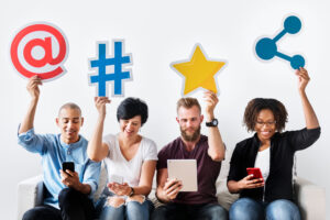 Practical strategies for online reputation management in social networks - people sitting on a white couch holding in their hands social media icons