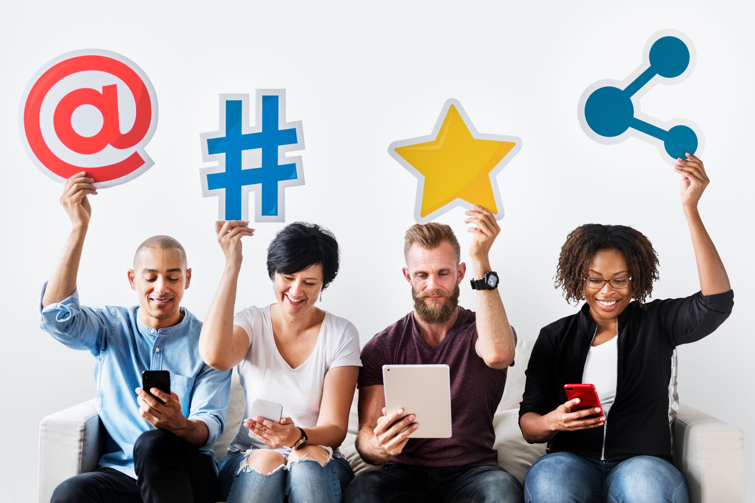 Practical strategies for online reputation management in social networks - people sitting on a white couch holding in their hands social media icons